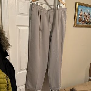 Perry Ellis portfolio slacks in beige. The pants show little signs of wear.